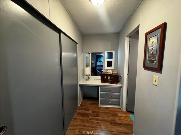 a kitchen with kitchen island a sink stainless steel appliances and cabinets