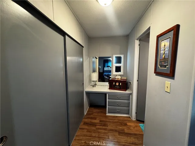 a kitchen with kitchen island a sink stainless steel appliances and cabinets