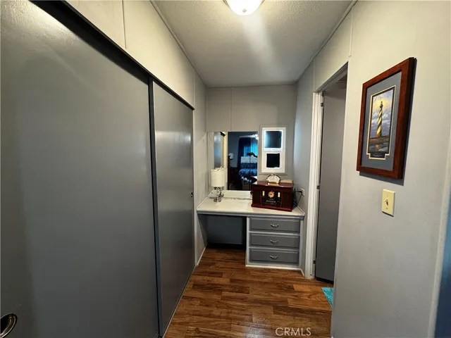 a kitchen with kitchen island a sink stainless steel appliances and cabinets