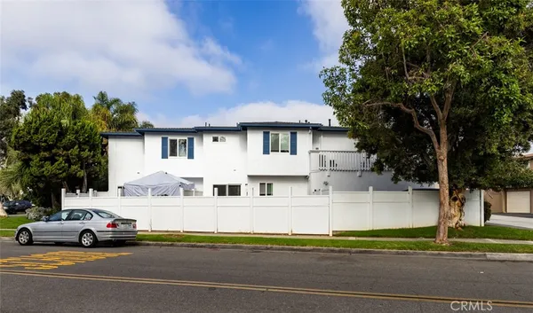 a view of a parked cars in front of a house