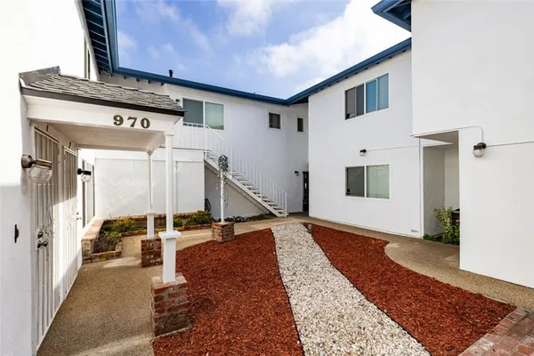 a view of a hallway with windows
