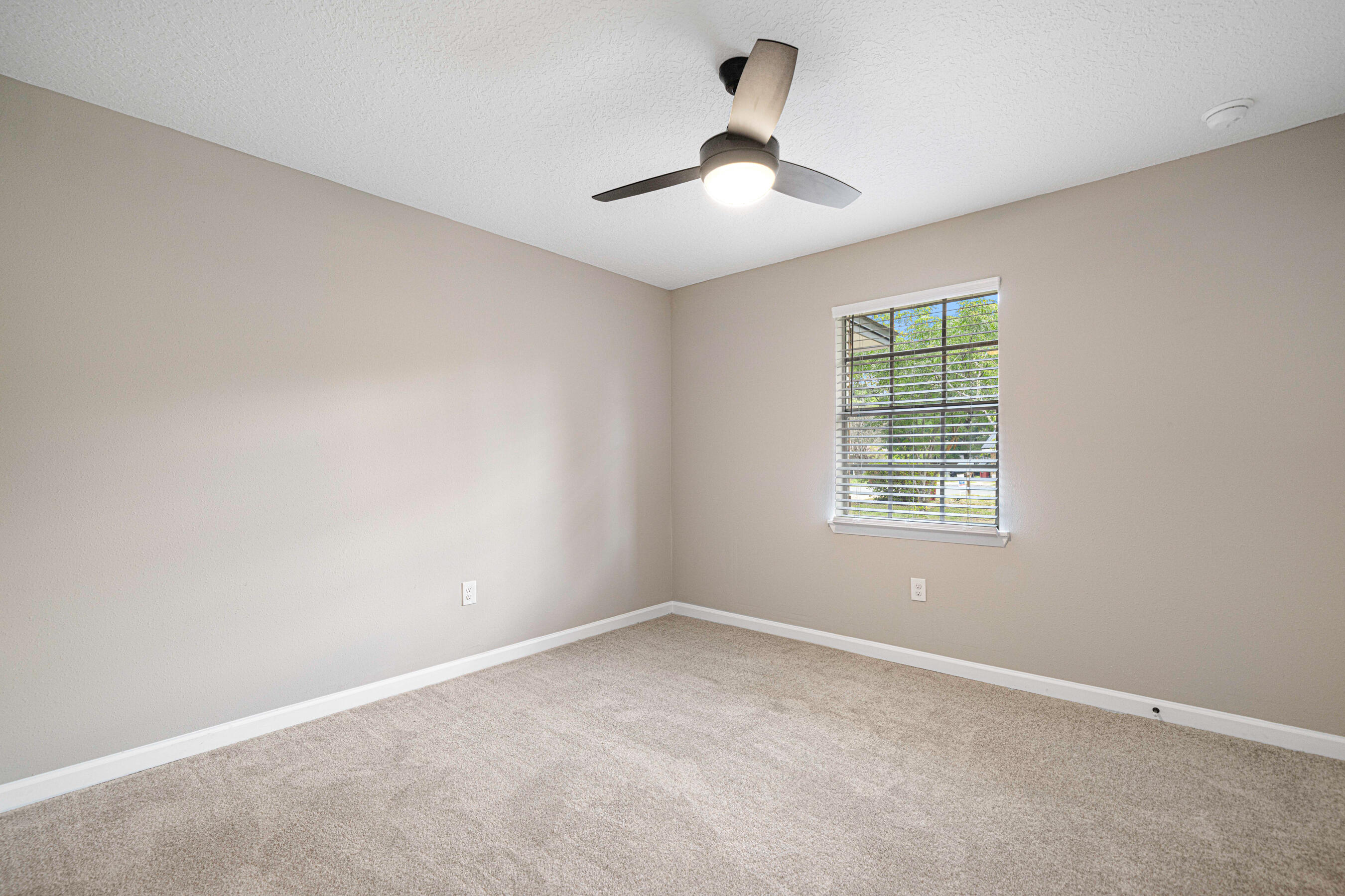 207 Oglesby Avenue Crestview, FL 32536 - Photo 24 of 30 an empty room with a window and a fan