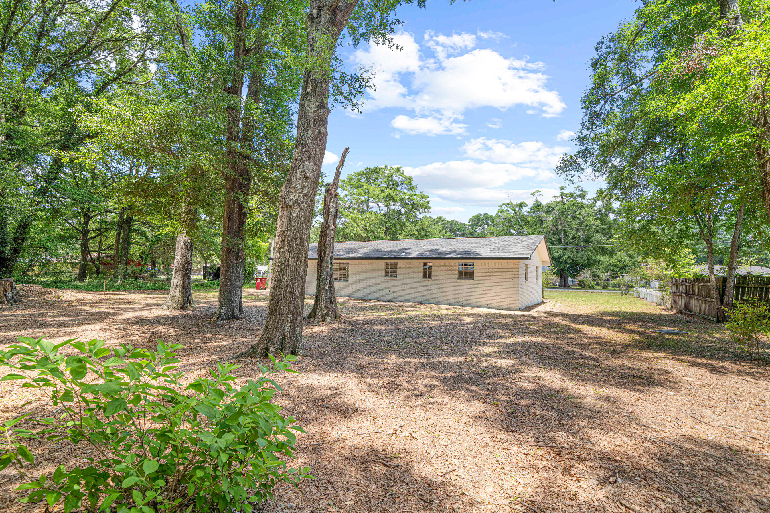 207 Oglesby Avenue Crestview, FL 32536 - Photo 29 of 30 a view of a house with a yard and tree