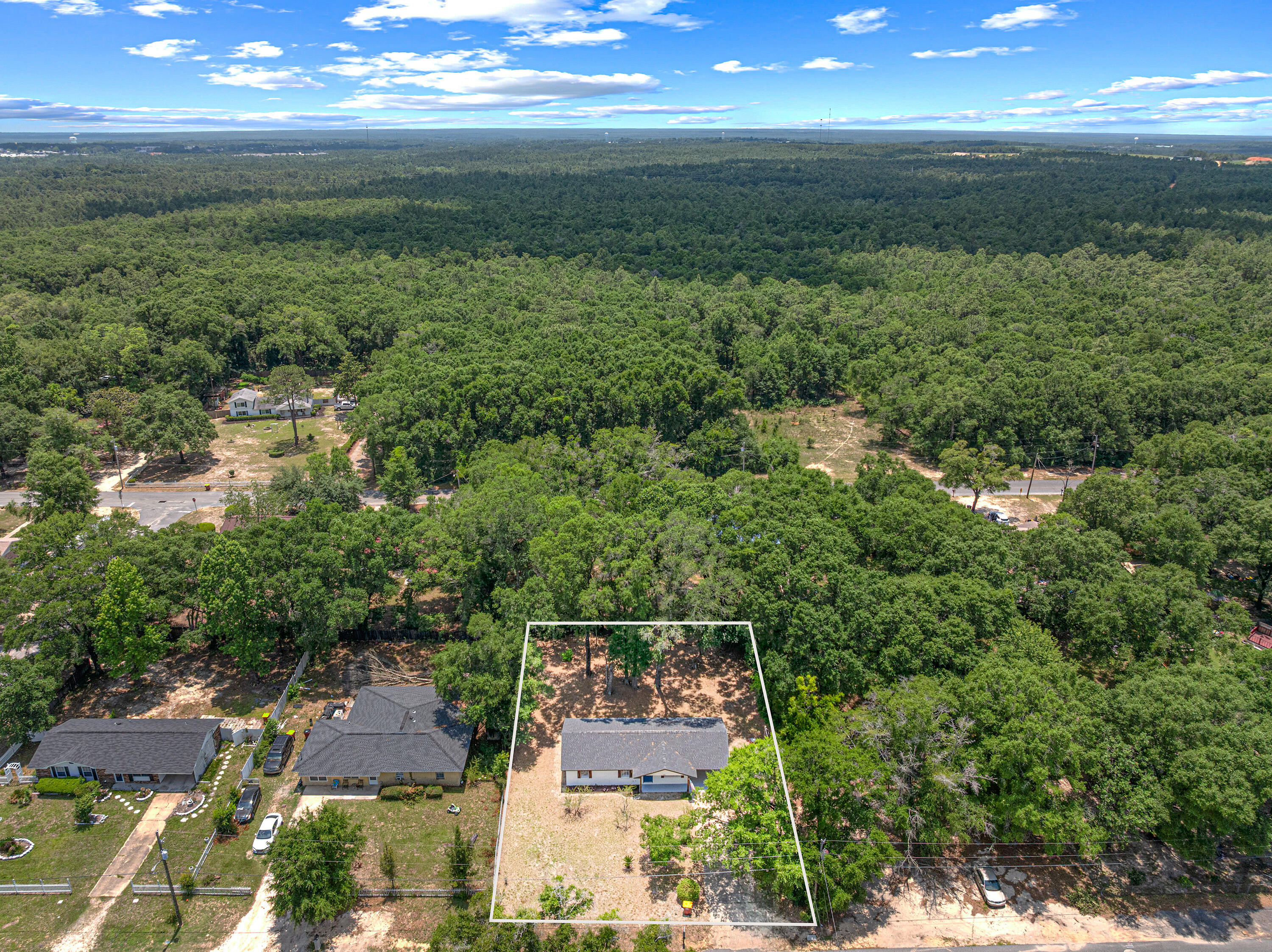 207 Oglesby Avenue Crestview, FL 32536 - Photo 30 of 30 an aerial view of residential houses with outdoor space and trees