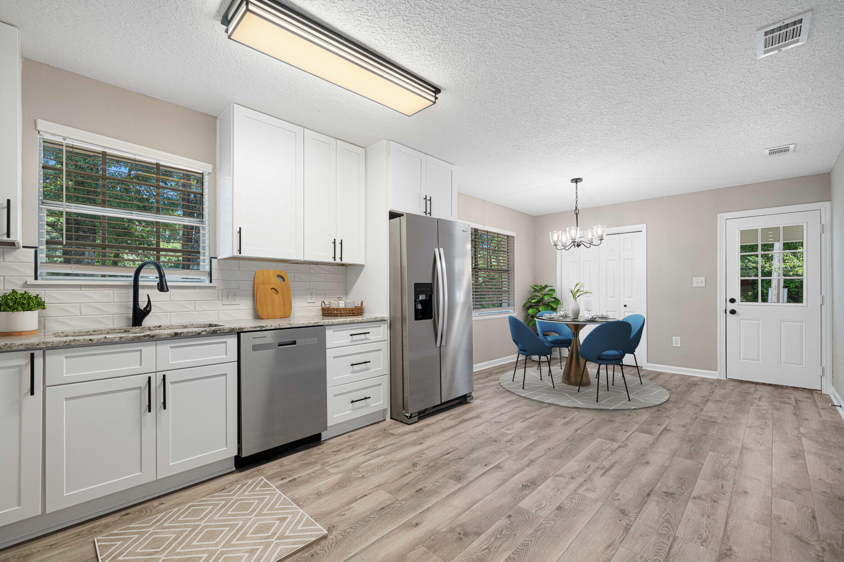 207 Oglesby Avenue Crestview, FL 32536 - Photo 3 of 30 a kitchen with stainless steel appliances granite countertop a refrigerator and a sink