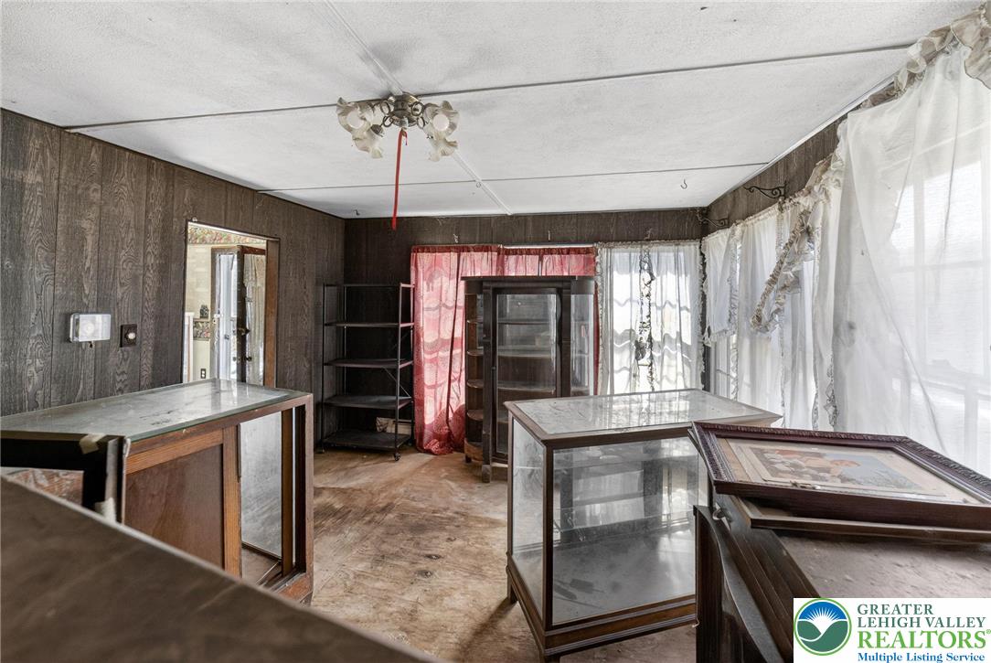 455 Morvale Road Easton, PA 18042 - Photo 13 of 47 a kitchen with kitchen island a counter top space a sink stainless steel appliances and cabinets