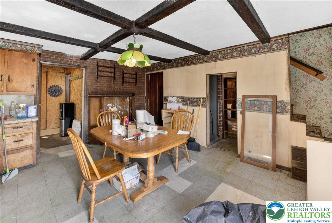 455 Morvale Road Easton, PA 18042 - Photo 15 of 47 a view of a dining room with furniture and a chandelier