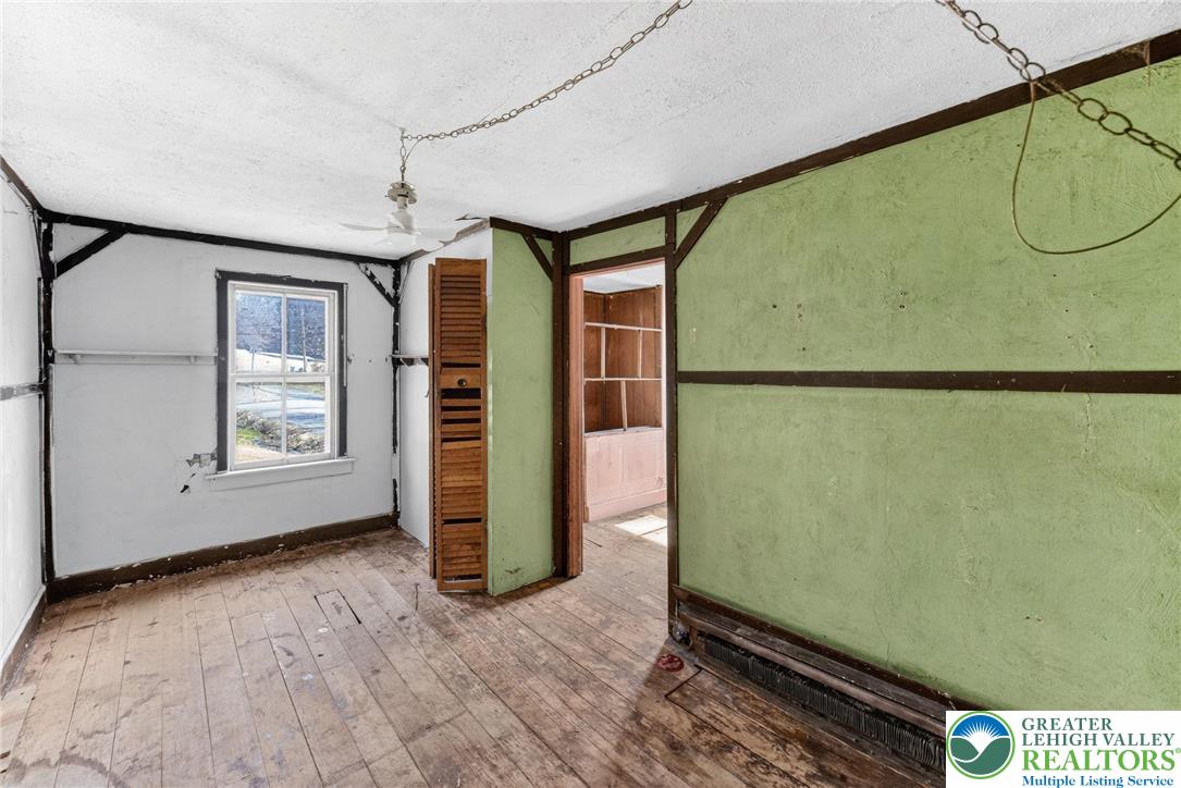 455 Morvale Road Easton, PA 18042 - Photo 23 of 47 a view of a room with wooden floor and windows