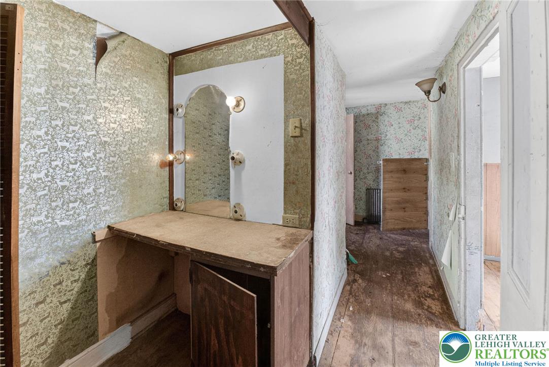 455 Morvale Road Easton, PA 18042 - Photo 27 of 47 a bathroom with a granite countertop sink a mirror and shower