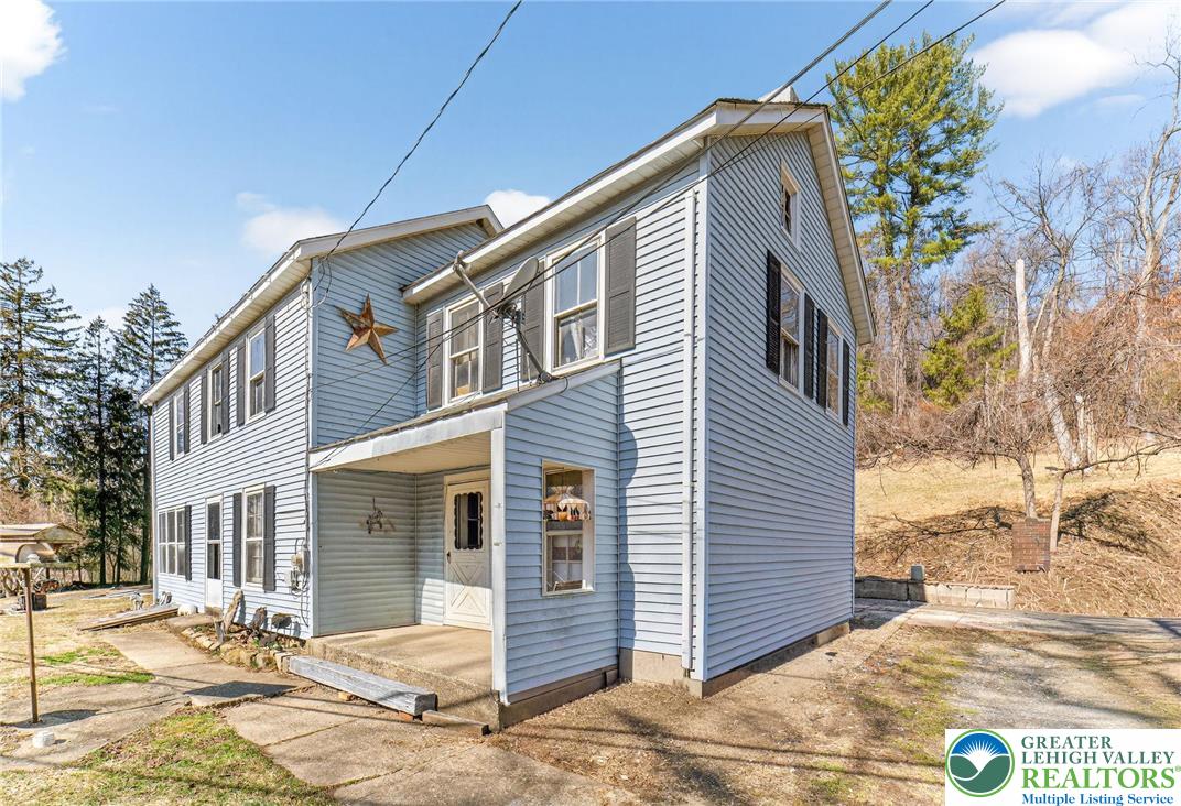 455 Morvale Road Easton, PA 18042 - Photo 7 of 47 a front view of a house with a yard