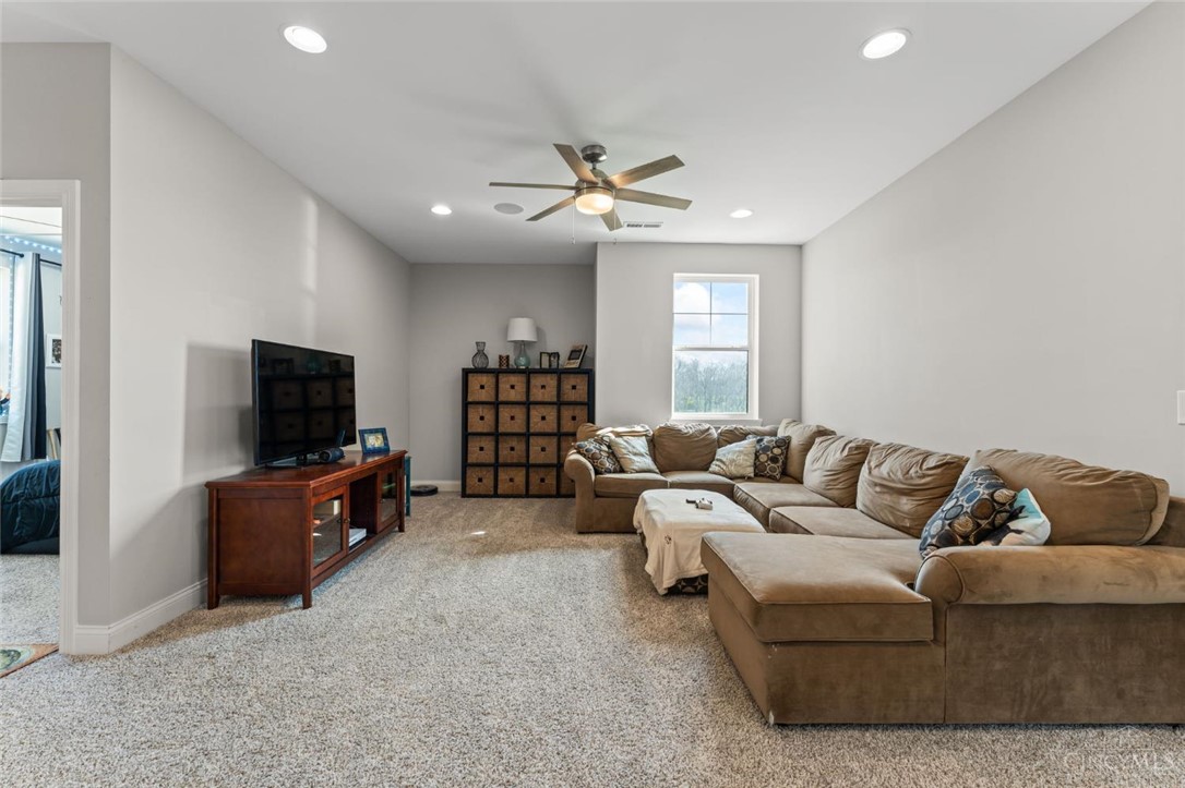 2425 Middleboro Road Clarksville, OH 45113 - Photo 57 of 91 This inviting living room offers comfort and ample space for relaxation.