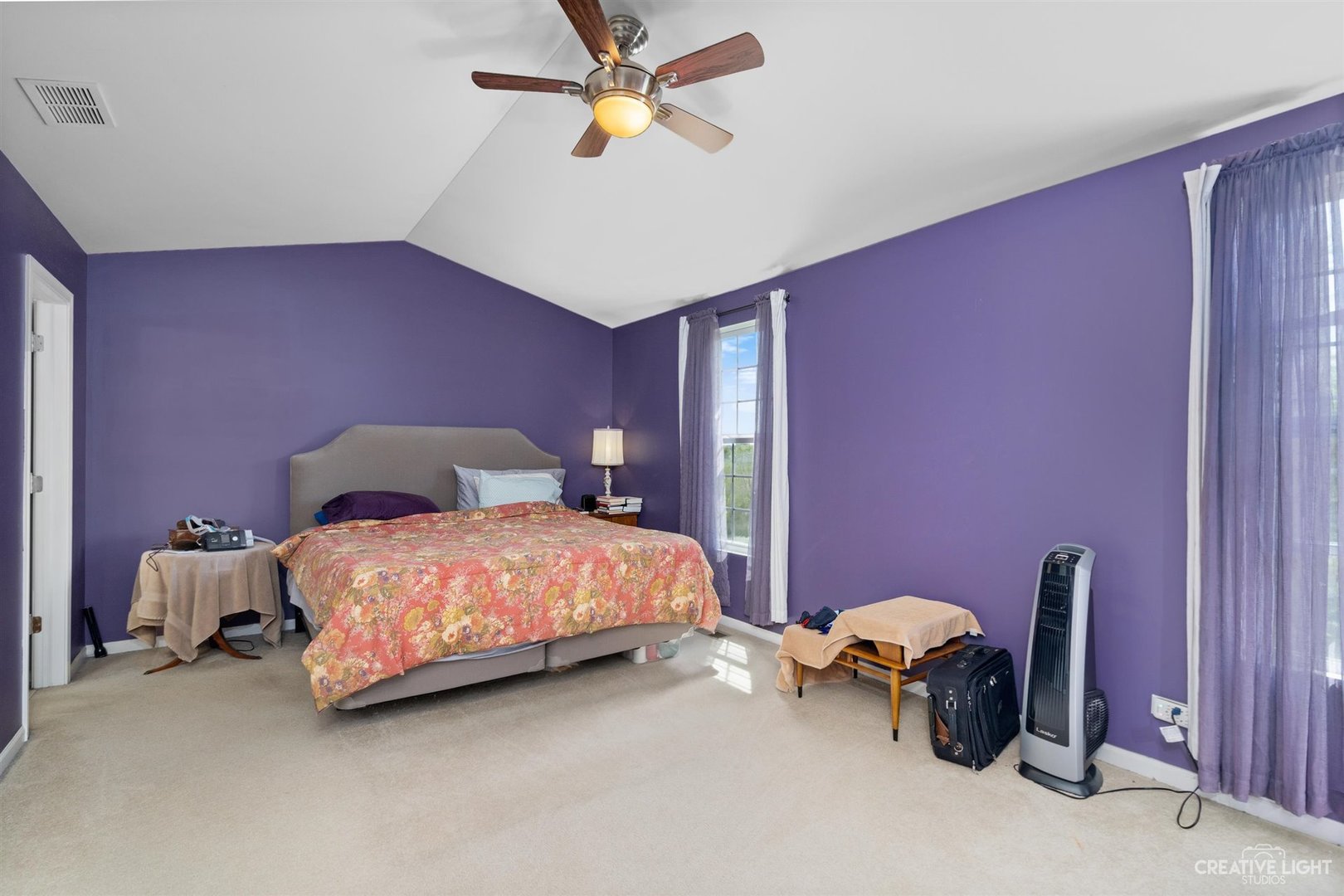 1005 Crane Point Elgin, IL 60124 - Photo 10 of 18 a bedroom with a bed and a chandelier