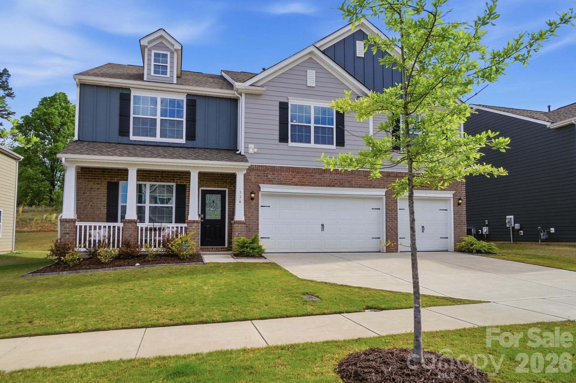 116 Timbergreen Court Troutman, NC 28166 - Photo 1 of 43 a front view of a house with a yard and garage