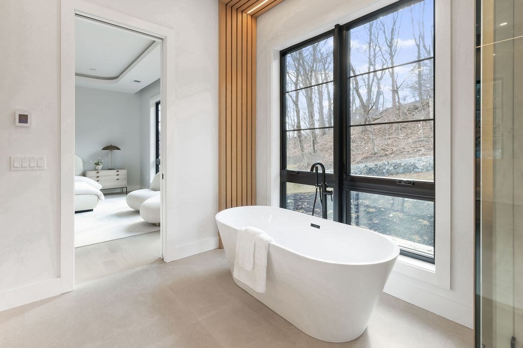 28 Cottonwood Road Newton, MA 02459 - Photo 17 of 25 a bathroom with a bathtub and a toilet