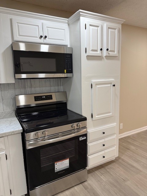 2000 Fairview Boulevard Fairview, TN 37062 - Photo 13 of 35 a stove top oven sitting inside of a kitchen
