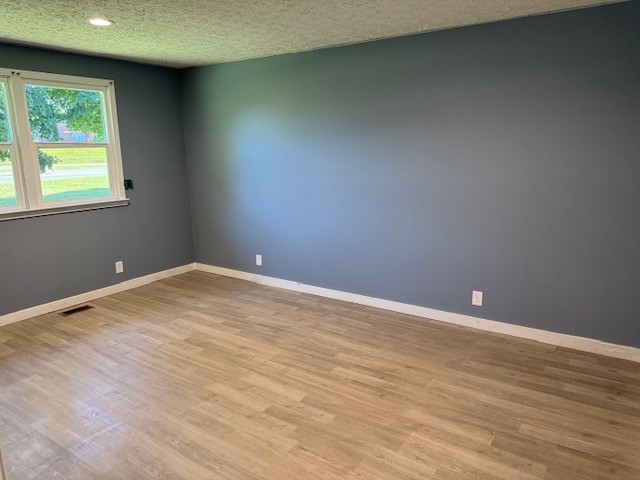 2000 Fairview Boulevard Fairview, TN 37062 - Photo 23 of 35 a view of an empty room with wooden floor and a window