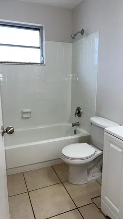 a bathroom with a toilet a sink and a bathtub