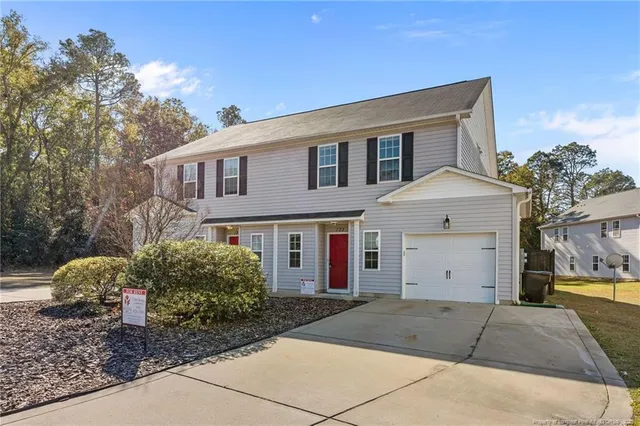 a view of multiple houses with a yard