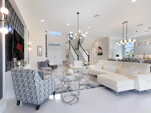 a large kitchen with a table and chairs