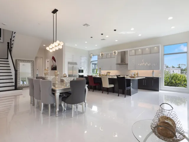 a kitchen with a sink stainless steel appliances and cabinets
