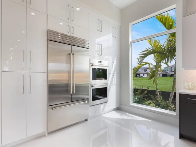 an empty room with windows and painted walls