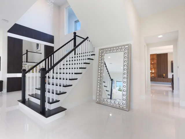 a bathroom with a mirror and a shower