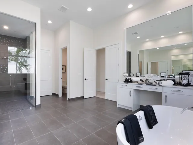 a bedroom with bed and a window