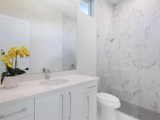 a bathroom with a sink toilet and vanity