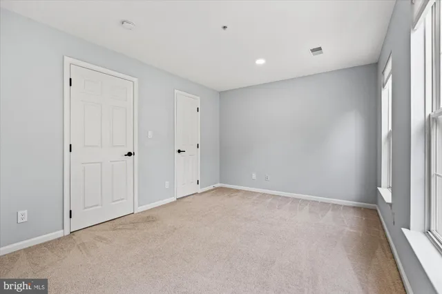 a bathroom with a toilet a sink a bathtub and a mirror