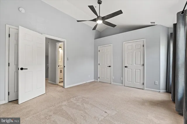 a view of a backyard with table and chairs and wooden fence