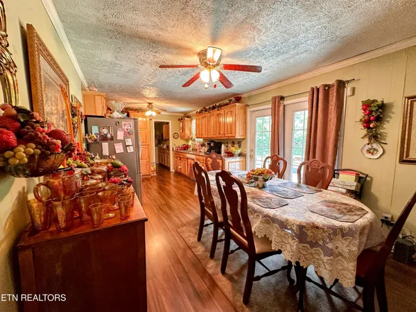 a view of a dining room with furniture and window