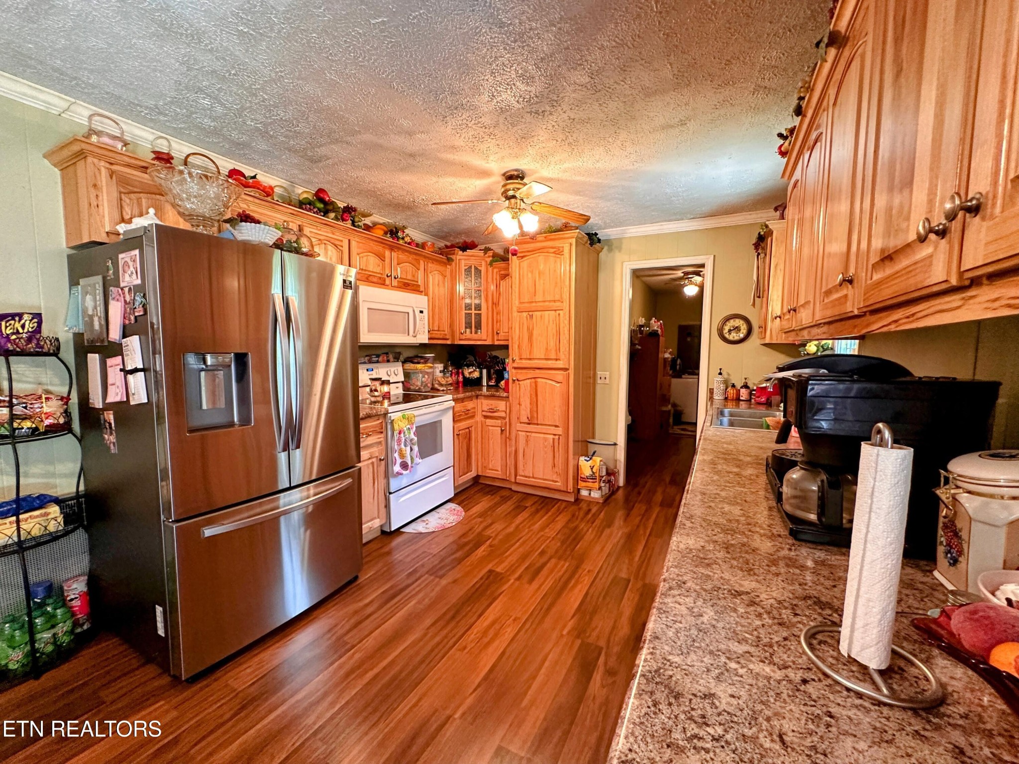 1065 Star Point Road Jamestown, TN 38556 - Photo 13 of 40 a kitchen with stainless steel appliances granite countertop a refrigerator stove and wooden floor