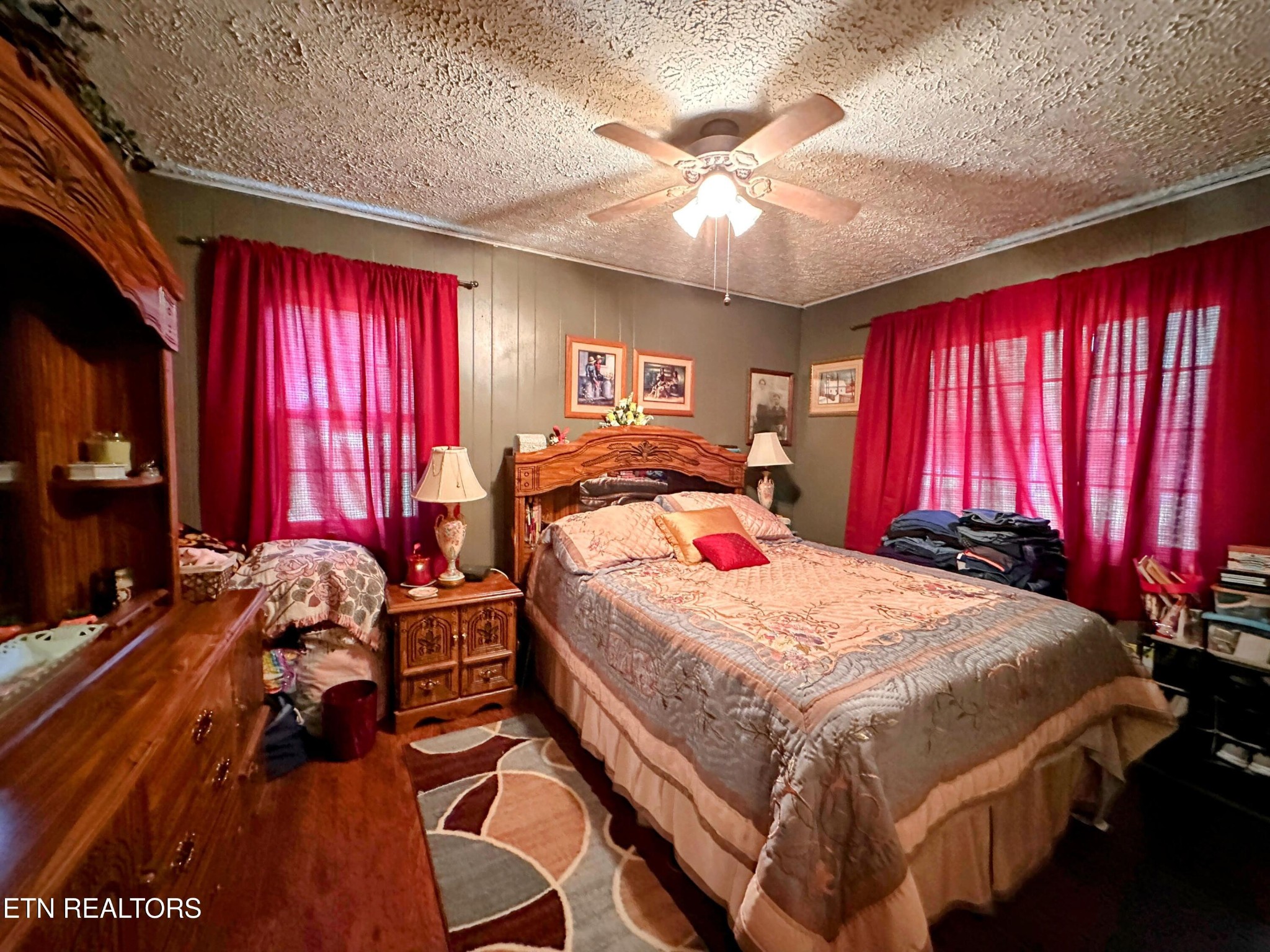 1065 Star Point Road Jamestown, TN 38556 - Photo 2 of 40 a bedroom with a bed and a chandelier