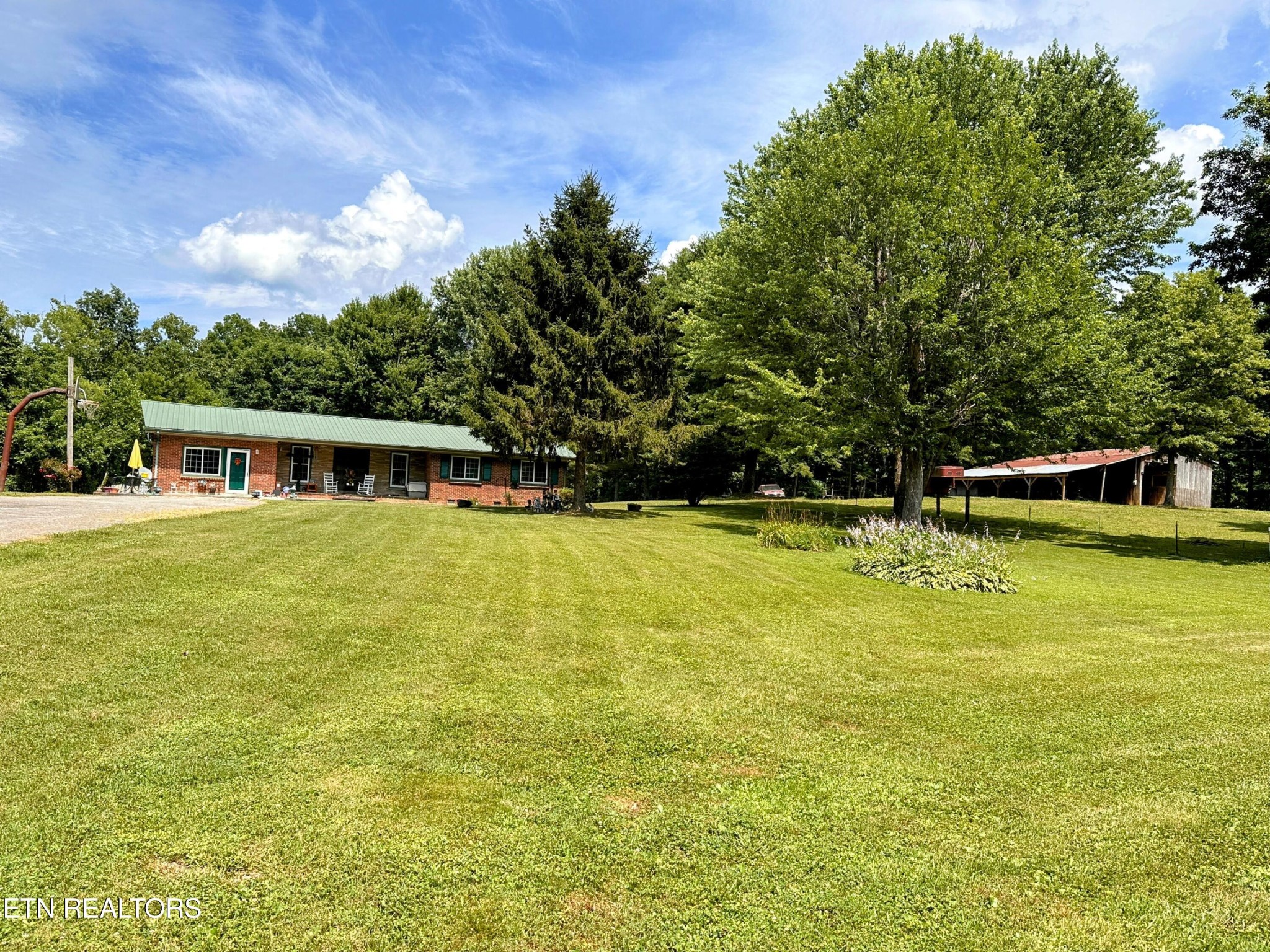1065 Star Point Road Jamestown, TN 38556 - Photo 28 of 40 a front view of house with yard and trees