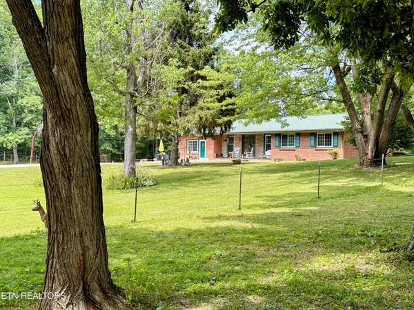 a view of a house with a big yard