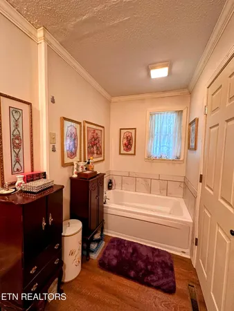 a bathroom with a bathtub toilet and sink