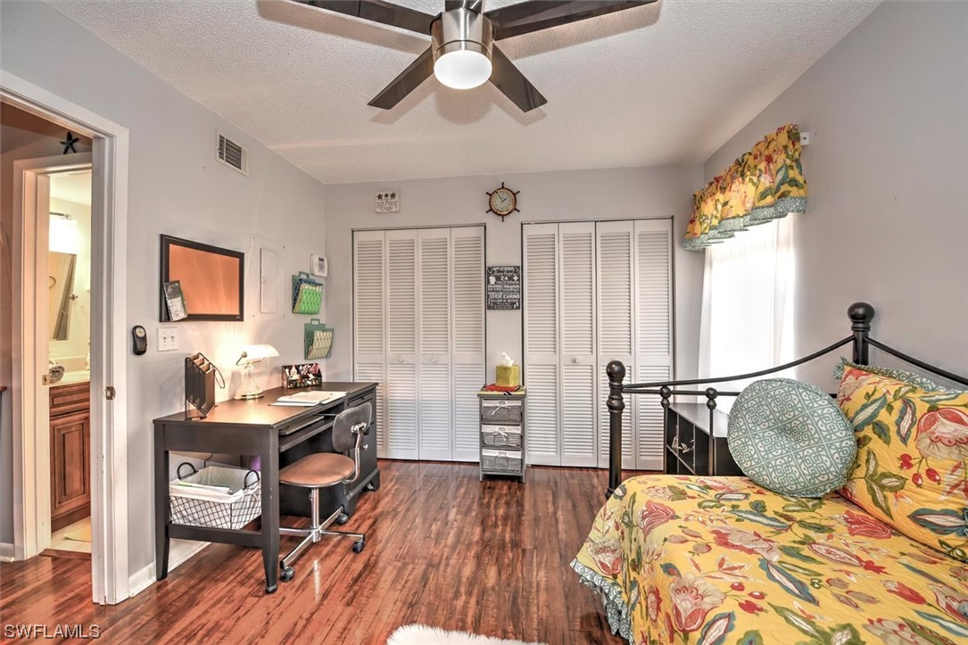 13260 Broadhurst Loop Fort Myers, FL 33919 - Photo 13 of 25 a bedroom that has a bed and a table in it