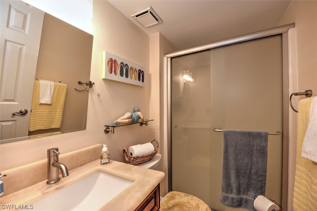 13260 Broadhurst Loop Fort Myers, FL 33919 - Photo 14 of 25 a bathroom with a sink toilet and shower