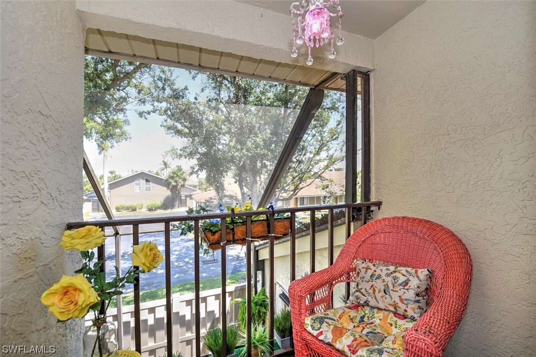 13260 Broadhurst Loop Fort Myers, FL 33919 - Photo 16 of 25 a balcony with table and chairs