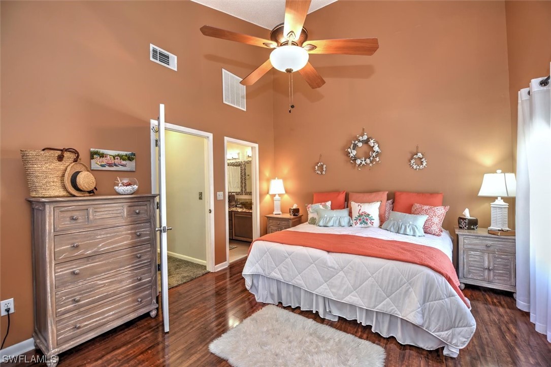 13260 Broadhurst Loop Fort Myers, FL 33919 - Photo 17 of 25 a bedroom with a bed and a chandelier