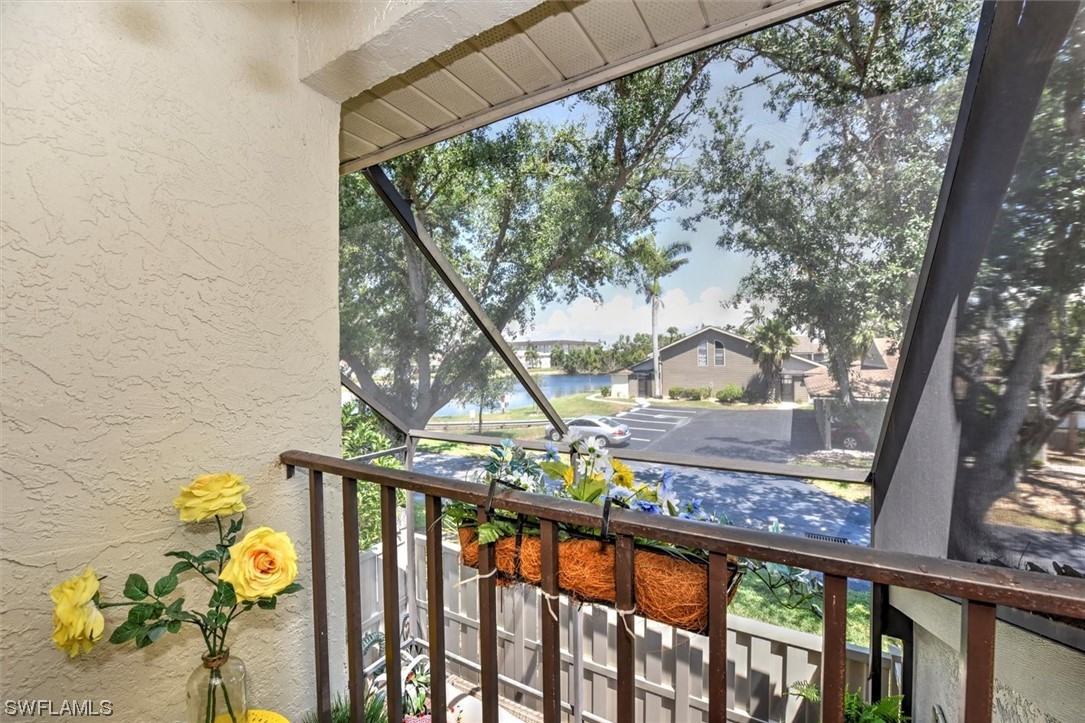 13260 Broadhurst Loop Fort Myers, FL 33919 - Photo 18 of 25 a view of trees and cars from a balcony