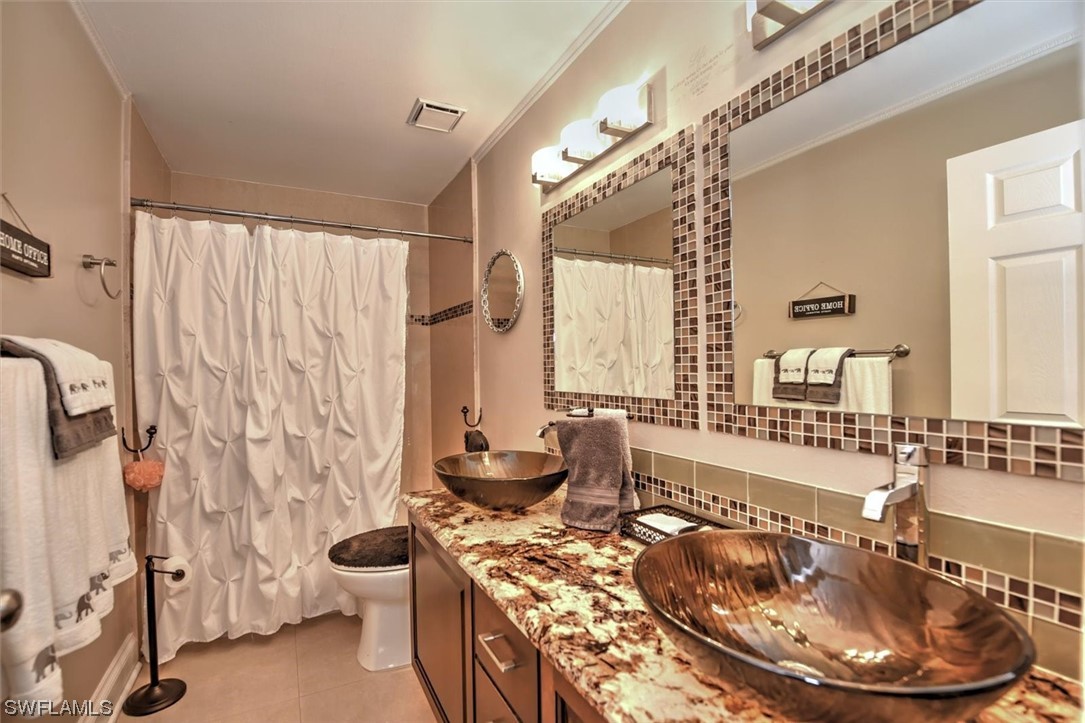 13260 Broadhurst Loop Fort Myers, FL 33919 - Photo 19 of 25 a room with a couch and a table