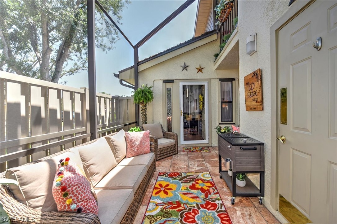 13260 Broadhurst Loop Fort Myers, FL 33919 - Photo 2 of 25 a balcony with furniture and rug