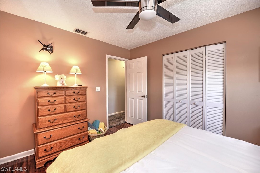 13260 Broadhurst Loop Fort Myers, FL 33919 - Photo 21 of 25 a bedroom with a bed and a dresser
