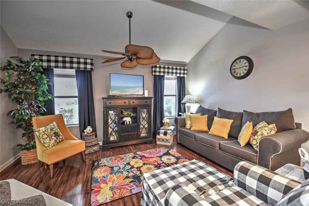 13260 Broadhurst Loop Fort Myers, FL 33919 - Photo 6 of 25 a living room with furniture a fireplace and a chandelier