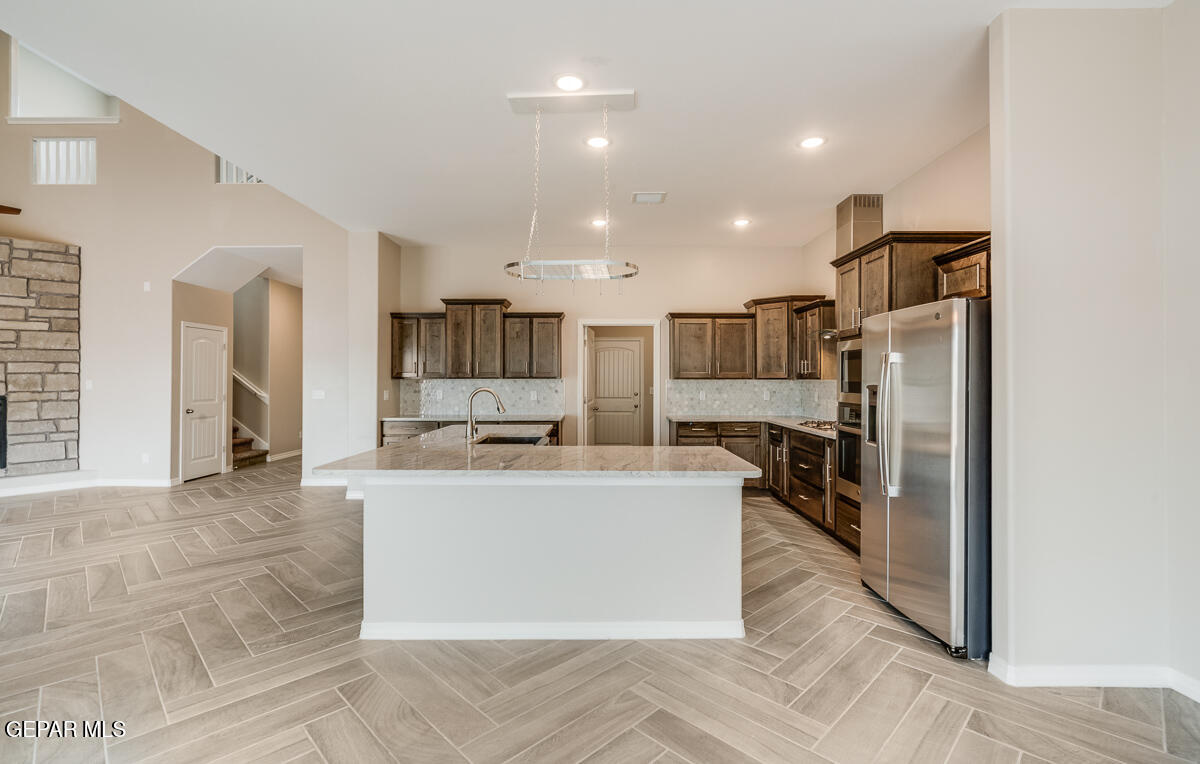 12432 Fill Ball El Paso, TX 79928 - Photo 15 of 37 a large kitchen with stainless steel appliances lots of counter space and a refrigerator