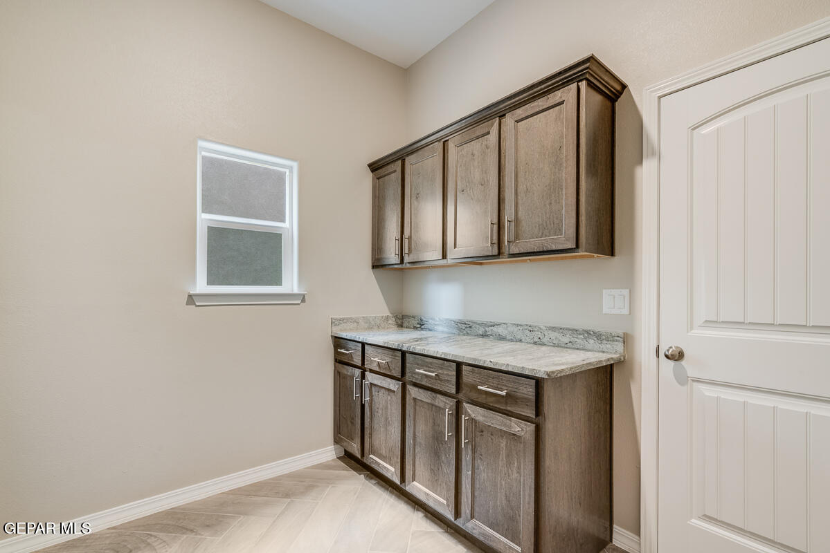 12432 Fill Ball El Paso, TX 79928 - Photo 19 of 37 a kitchen with stainless steel appliances granite countertop a sink a stove and a microwave oven