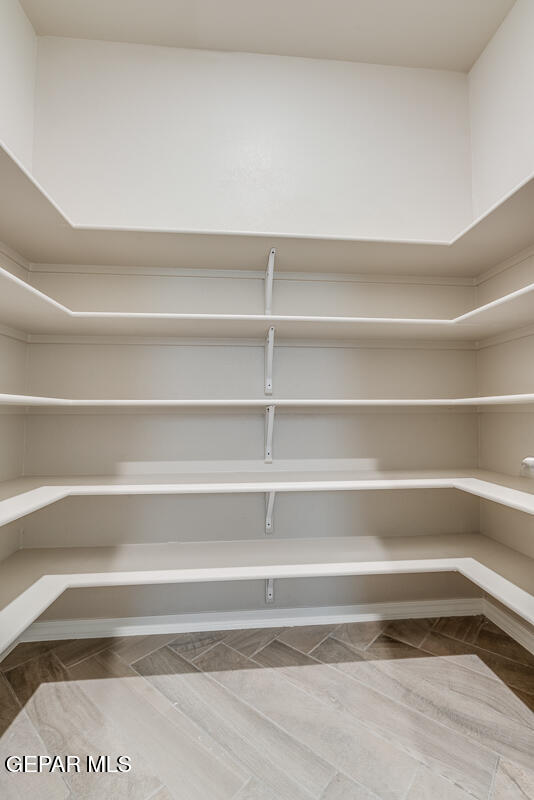 12432 Fill Ball El Paso, TX 79928 - Photo 20 of 37 a view of walk in closet with empty racks