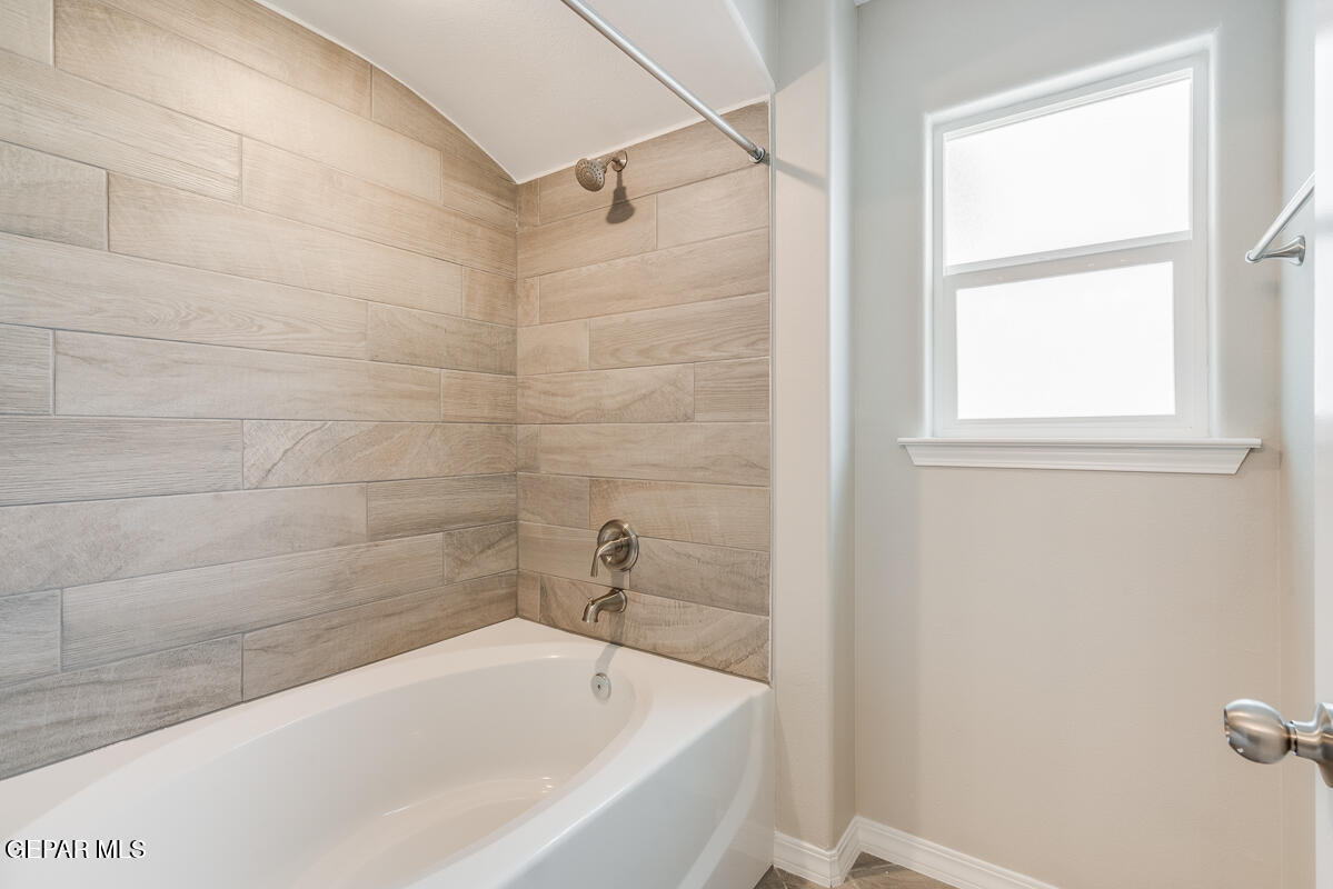 12432 Fill Ball El Paso, TX 79928 - Photo 21 of 37 a white bath tub sitting next to a window