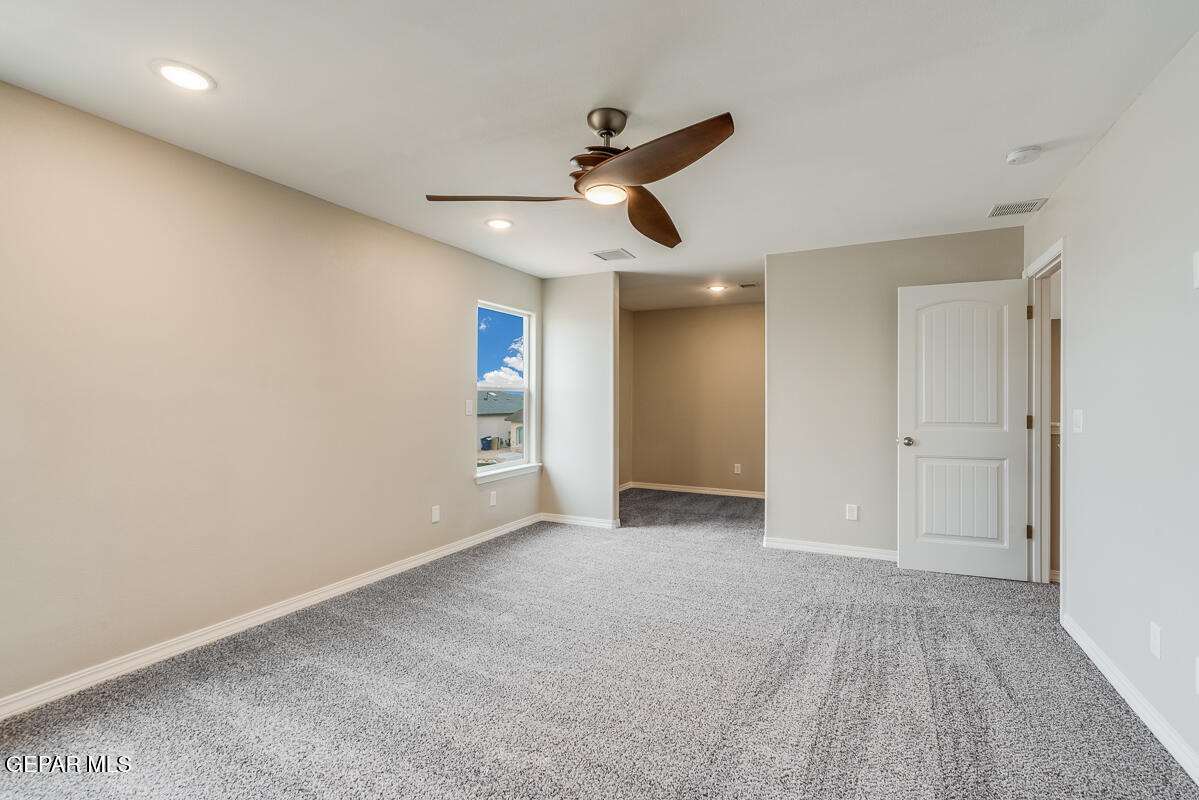 12432 Fill Ball El Paso, TX 79928 - Photo 31 of 37 a view of an empty room and a ceiling fan